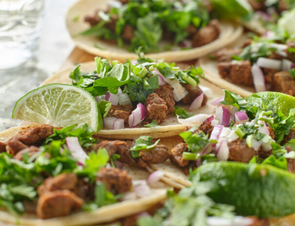 wooden-tray-with-carne-asada-tacos-on-corn-tortill-2023-11-27-04-49-31-utc-scaled.jpg